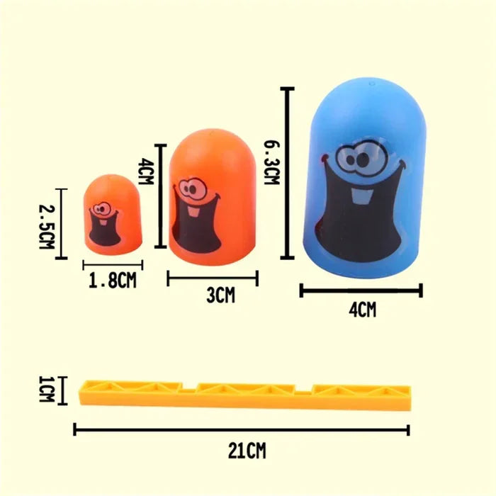 Peças de brinquedo coloridas com rostos sorridentes, medidas em centímetros, itens infantis lúdicos.